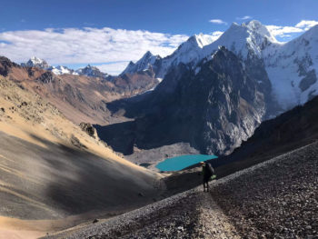 This picture shows Jeremy in the foreground of Touching the Void’s mountain, Siula Grande. The shadowed glacier on the mountain’s left flank contains the crevasse Simpson was forced to crawl out of and onwards for a further three miles.
